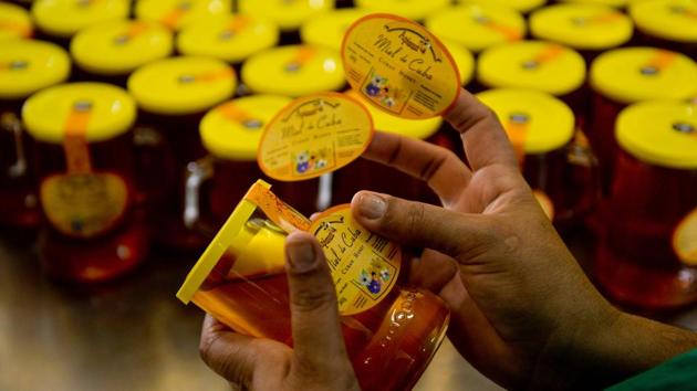 Apicuba has a monopoly on exports -- beekeepers with more than five hives must sell it their honey. In exchange, the organization provides them with discounted fuel and equipment. And the quality is excellent, according to Adolfo Perez, head of the Apicultural Research Center. “Because of the tendency to use very little chemicals, we can say that the honey of Cuba is almost all organic honey,” said Perez. (Yamil Lage / AFP)