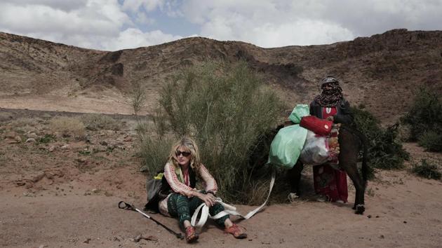 Julie Patterson, a Sinai Trail trip officer rests with Umm Yasser. Younger Bedouin girls tagged along with the group and talked about wanting to be female guides in the future. “This trip is going down in history and will be talked about,” said Paterson. “It might also go into Bedouin oral history.” (Nariman El-Mofty / AP) 