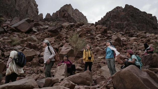 Tourists trek in the mountains near Wadi Sahw in South Sinai. Violence has stayed far from southern Sinai, where tourist resorts are located — but the industry has had to push hard to win tourists back. On a recent tour joined by the Associated Press, 16 female tourists — from Korea, New Zealand, Europe, Lebanon and Egypt were led through the rugged landscape in and around Wadi Sahu. (Nariman El-Mofty / AP) 