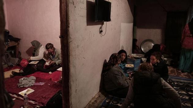 Women eat in Umm Yasser’s home in Wadi Sahw. Umm Yasser is skeptical other Bedouin women will join her as a guide or in working in general any time soon. But, she said, “There is no shame in working. This is what I believe in, and it makes me strong.” (Nariman El-Mofty / AP) 