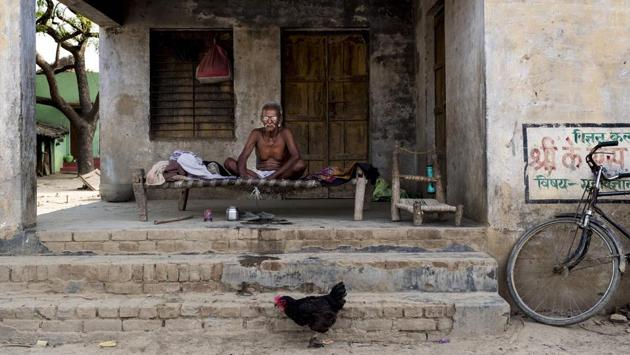 A resident rests in his house on a charpai, a traditional woven bed, in Sirsa, Uttar Pradesh. (Xavier Galiana / AFP) A resident rests in his house on a charpai, a traditional woven bed, in Sirsa, Uttar Pradesh. (Xavier Galiana / AFP)