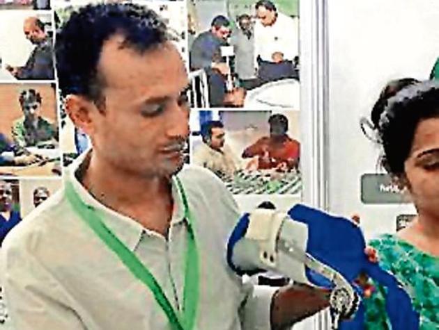 Aneesh Karma with his KAFO caliper invention. (HT Photo) Aneesh Karma with his KAFO caliper invention. (HT Photo)