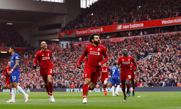Liverpool's Mohamed Salah celebrates scoring their second goal against Chelsea on April 14. The English Premier League is in for a frenzied finish.(REUTERS)