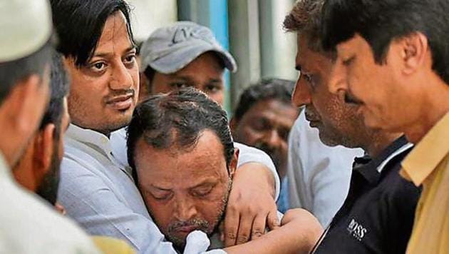 Shakir Hussain (centre) father of Mohammad Salman, being comforted by relatives at the Maulana Azad Medical College . (Burhaan Kinu / HT Photo) Shakir Hussain (centre) father of Mohammad Salman, being comforted by relatives at the Maulana Azad Medical College . (Burhaan Kinu / HT Photo)