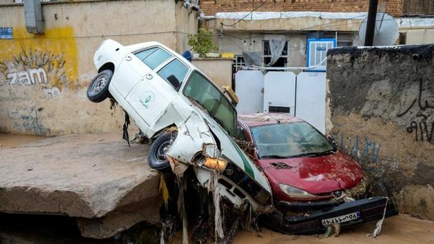 Damaged vehicles are seen after a flash flooding in Shiraz, Iran. (REUTERS) Damaged vehicles are seen after a flash flooding in Shiraz, Iran. (REUTERS)