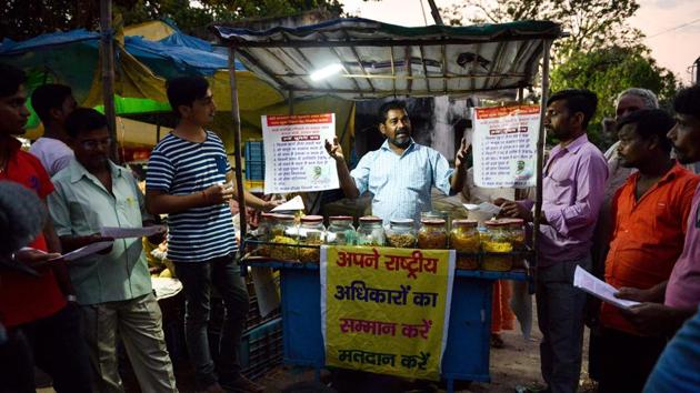 “Voting in India is either personality or party driven. No one ever bothers to vote for a candidate on merit, like how honest he is or if he is a criminal,” said Das. He engages with random members of the public and his customers alike, explaining to them the importance of exercising their democratic right to cast a ballot. (Narinder Nanu / AFP) “Voting in India is either personality or party driven. No one ever bothers to vote for a candidate on merit, like how honest he is or if he is a criminal,” said Das. He engages with random members of the public and his customers alike, explaining to them the importance of exercising their democratic right to cast a ballot. (Narinder Nanu / AFP)