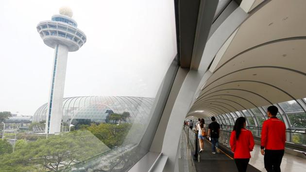 The Changi Airport control tower pictured next to Jewel. The vision is as a lifestyle destination that will keep Changi ahead of its rivals. Tourist arrivals to Singapore have been steadily climbing. In 2018, about 18.5 million tourists arrived compared with 15 million 5 years ago --an increase of over 23% with a compounded annual growth rate of about 4.5%. (Feline Lim / REUTERS) 