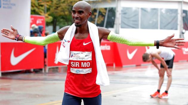 Mo Farah of Britain celebrates after winning the Chicago Marathon in Chicago, on October 7, 2018(AFP)