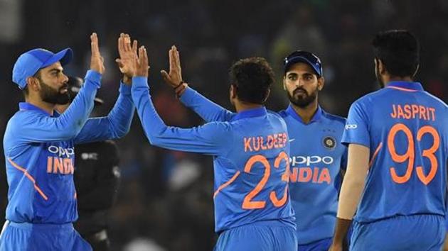 India cricketer Kuldeep Yadav (2L) celebrates the wicket of Australia cricketer Glenn Maxwell with captain Virat Kohli (L) and teammates during the fourth one-day international (ODI) cricket match between India and Australia at the Punjab Cricket Association Stadium in Mohali on March 10, 2019. (AFP) India cricketer Kuldeep Yadav (2L) celebrates the wicket of Australia cricketer Glenn Maxwell with captain Virat Kohli (L) and teammates during the fourth one-day international (ODI) cricket match between India and Australia at the Punjab Cricket Association Stadium in Mohali on March 10, 2019. (AFP)