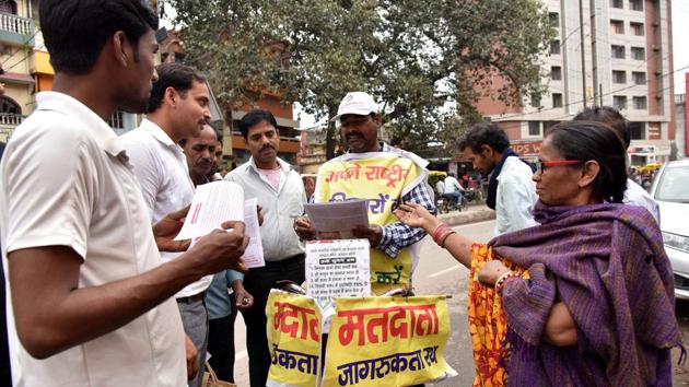 Lal Mani Das, hands out voting information pamphlets and speaks to prospective voters during his own election awareness campaign in Patna, Bihar. “I felt a strong urge to do something about how people waste their votes by either electing wrong candidates or not voting at all,” Das told AFP as he cycled along a chaotic road with banners festooning his bike and body. (Sachin Kumar / AFP) Lal Mani Das, hands out voting information pamphlets and speaks to prospective voters during his own election awareness campaign in Patna, Bihar. “I felt a strong urge to do something about how people waste their votes by either electing wrong candidates or not voting at all,” Das told AFP as he cycled along a chaotic road with banners festooning his bike and body. (Sachin Kumar / AFP)