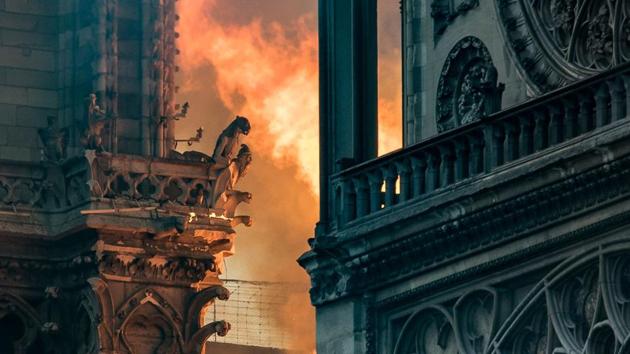 Flames and smoke billow around the gargoyles decorating the roof and sides of the Notre-Dame Cathedral. The cathedral went on to feature as a central character in a Victor Hugo novel published in 1831, “The Hunchback of Notre-Dame” and shortly afterwards a restoration project lasting two decades got under way, led by architect Eugene Viollet-le-Duc. (Thomas Samson / AFP) Flames and smoke billow around the gargoyles decorating the roof and sides of the Notre-Dame Cathedral. The cathedral went on to feature as a central character in a Victor Hugo novel published in 1831, “The Hunchback of Notre-Dame” and shortly afterwards a restoration project lasting two decades got under way, led by architect Eugene Viollet-le-Duc. (Thomas Samson / AFP)