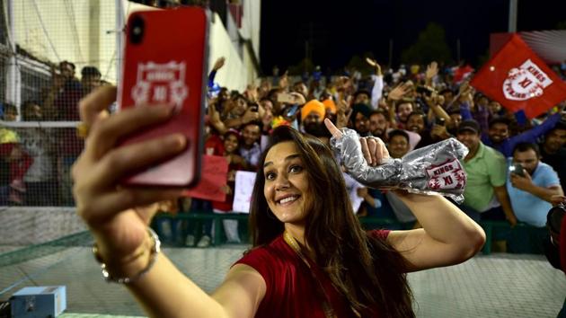 Mohali: KXIP co-owner Preity Zinta takes selfie with fans. (PTI) Mohali: KXIP co-owner Preity Zinta takes selfie with fans. (PTI)