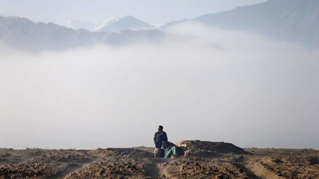 An Afghan hunter watches birds in the sky at a hunting field in Bagram. The birds are usually taken to shops near the town of Bagram or to Kabul itself, where there is a popular bird market in the centre of the old city. (Mohammad Ismail / REUTERS) An Afghan hunter watches birds in the sky at a hunting field in Bagram. The birds are usually taken to shops near the town of Bagram or to Kabul itself, where there is a popular bird market in the centre of the old city. (Mohammad Ismail / REUTERS)