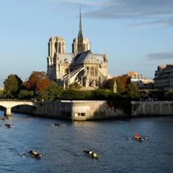 FILE PHOTO: Rowers pass Notre Dame Cathedral on their boats in Paris, September 26, 2010. REUTERS/Benoit Tessier/File Photo(REUTERS)