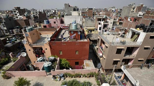 The Centre-appointed committee mandated to recommend the process of giving ownership rights to residents of 1,797 unauthorised colonies is considering using satellite images to fix the boundaries of these colonies.(Biplov Bhuyan/HT PHOTO)