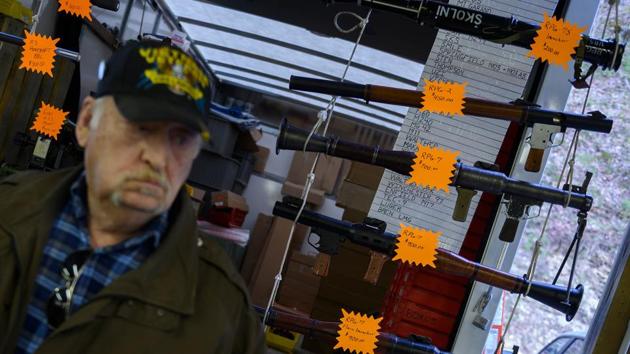A man walks past a vendor selling inactive Rocket Propelled Grenades (RPGs) at the Knob Creek Machine Gun Shoot and Military Gun show. There are shooting competitions featuring sub-machine guns, shotguns and pistols. (Andrew Caballero-Reynolds / AFP)