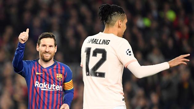 Barcelona's Argentinian forward Lionel Messi (L) gestures beside Manchester United's English defender Chris Smalling(AFP) Barcelona's Argentinian forward Lionel Messi (L) gestures beside Manchester United's English defender Chris Smalling(AFP)