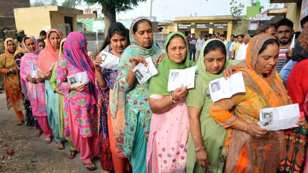 Jammu, India - April 11, 2019: Voters stand in queues to cast their votes at a polling booth for the first phase of general elections, in Jammu, India, on Thursday, April 11, 2019. Voters in 18 Indian states and two Union Territories began casting ballots on Thursday, the first day of a seven-phase election staggered over six weeks in the country of 1.3 billion people. (Photo by Nitin Kanotra / Hindustan Times)