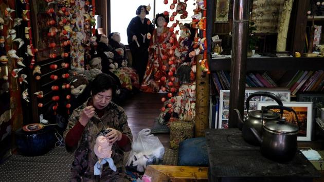 Tsukimi Ayano making the head of a life-size doll at her house. The country is on the verge of becoming the first “ultra-aged” country in the world, meaning that 28% of people are aged 65 or above. The latest government report shows that 27.7% of a population of 127 million -- one in four people -- are aged 65 or older and the figure is expected to jump to 37.7% in 2050. (Kazuhiro Nogi / AFP) 