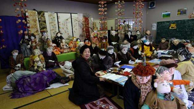 Tsukimi Ayano with life-size dolls in her workshop. While there is little evidence of citizens returning to Nagoro, Ayano’s dolls have attracted flesh-and-blood people from as far afield as the US and France. “Before I started making scarecrows, nobody stopped by. Now many people visit here,” she said. (Kazuhiro Nogi / AFP) 