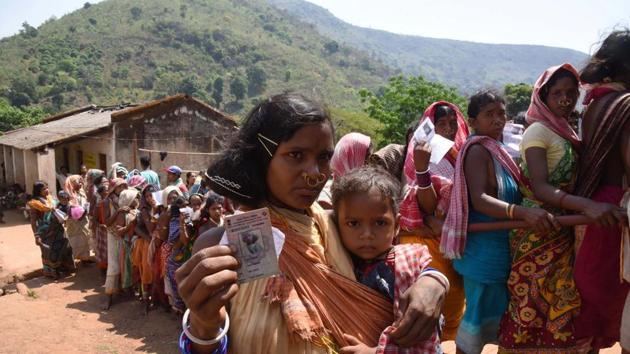 Odisha, India-April 11, 2019: Tribal women belonging to Dongria Kondh community stand in a queue to cast their vote during the first phase of the Lok Sabha elections, in Rayagada district, Odisha, India, on Thursday, April 11, 2019. (Photo by Arabinda Mahapatra / Hindustan Times)