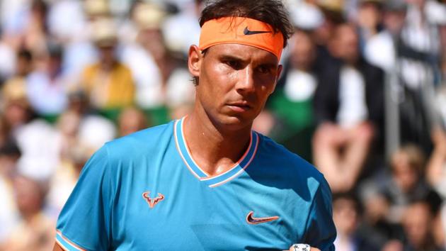 Spain's Rafael Nadal reacts during his tennis match against Spain's Roberto Bautista Agut.(AFP)