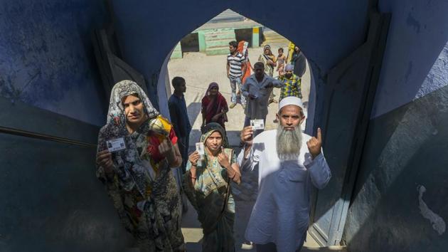 People show their ink-marked finger after casting vote at a polling station at Siyana, Bulandshahr. The voter turnout stood at 38.94% voter turnout at 1 pm in Uttar Pradesh. The highest was in Amroha- 43.26%, followed Hathras- 41.18, Bulandshahar- 39.70%, Nagina- 38.71%, Agra- 38.24%, Aligarh- 37.60%, Mathura- 36.90%, Fatehpur Sikri- 35.96%. (Vijay Verma / PTI)