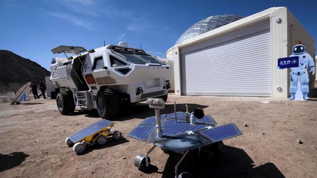 Models of Mars rovers are seen at the base. The company behind the project, C-Space, plans to open the base -- currently an educational facility -- to tourists in the next year, complete with a themed hotel and restaurant to attract space geeks. (Wang Zhao / AFP)