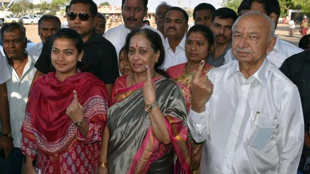 Congress leader Sushilkumar Shinde with his family members show their marked-fingers after casting their vote at Aas School in Amroha on Thursday. (ANI photo) Congress leader Sushilkumar Shinde with his family members show their marked-fingers after casting their vote at Aas School in Amroha on Thursday. (ANI photo)