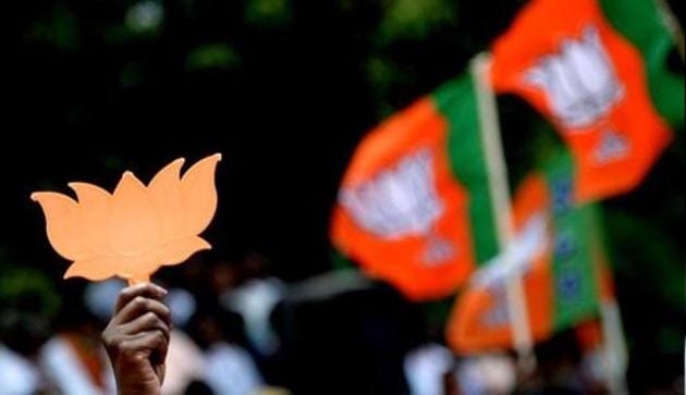 Supporters of Bhartiya Janta Party (BJP) wave party flags and cut-outs of the lotus. (AFP file photo) Supporters of Bhartiya Janta Party (BJP) wave party flags and cut-outs of the lotus. (AFP file photo)