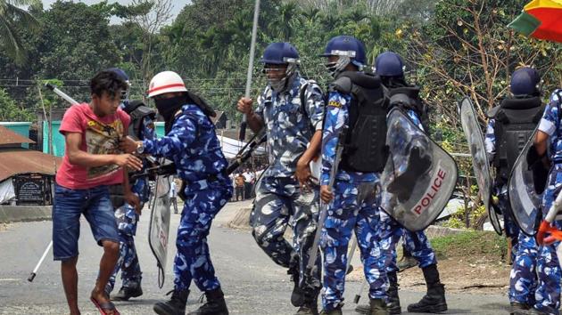 Police personnel take away a protester after clashes during the 2nd phase of Lok Sabha polls, at Chopra in Siliguri, Thursday, April 17, 2019. (PTI) Police personnel take away a protester after clashes during the 2nd phase of Lok Sabha polls, at Chopra in Siliguri, Thursday, April 17, 2019. (PTI)