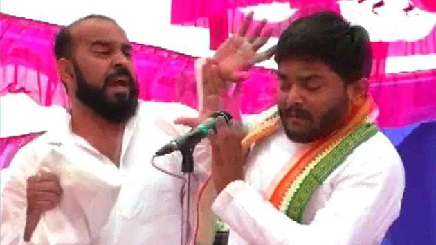 Hardik Patel, the face of the Patidar agitation who joined the Congress last month, was slapped by a man at an election meeting in Gujarat’s Surendranagar. Likening Congress leader Patel to Hitler, the man said he had decided in 2015 that he would hit the Patidar leader after he and his pregnant wife had to face problems due to the Patidar agitation. (ANI) 