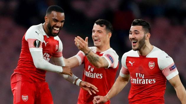 Arsenal's Alexandre Lacazette celebrates scoring their first goal with team mates. (Action Images via Reuters) Arsenal's Alexandre Lacazette celebrates scoring their first goal with team mates. (Action Images via Reuters)