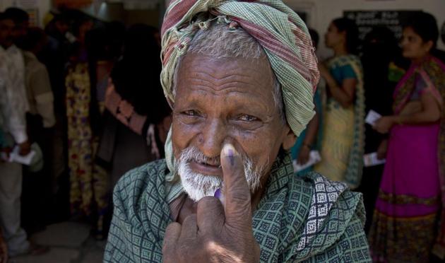 An Indian old man shows the indelible ink mark on his index finger after casting vote at a polling booth during the first phase of general elections in Hyderabad, India Thursday, April 11, 2019.(AP file photo)