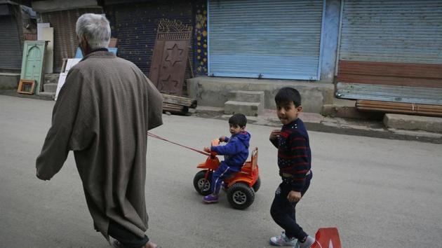 An elderly man pulls a child on a tricycle during a strike called on the second phase of general elections in Srinagar, Jammu and Kashmir. (Mukhtar Khan / AP) An elderly man pulls a child on a tricycle during a strike called on the second phase of general elections in Srinagar, Jammu and Kashmir. (Mukhtar Khan / AP)
