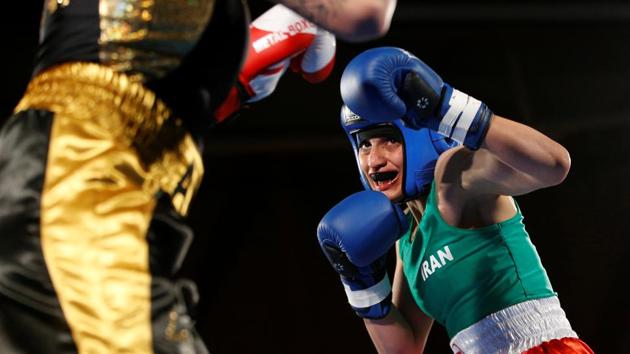 Iranian boxer Sadaf Khadem in action against French boxer Anne Chauvin during an official boxing bout in Royan, France. (Stephane Mahe / REUTERS) 