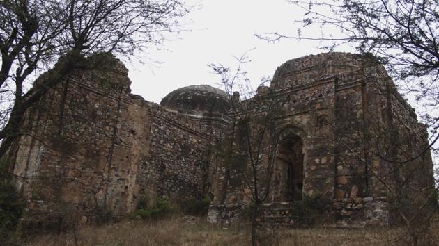 The bigger of the two sets of tomb complexes in the village is identified as Lal Gumbad by local residents, and derives its name from the red sandstone that makes up the tombs. Standing desolate on a hillock under the shadow of the Aravallis, multiple narrow pathways — dusty and covered with thorny bushes — take one to the complex that comprises of two tombs. (Yogendra Kumar / HT Photo) The bigger of the two sets of tomb complexes in the village is identified as Lal Gumbad by local residents, and derives its name from the red sandstone that makes up the tombs. Standing desolate on a hillock under the shadow of the Aravallis, multiple narrow pathways — dusty and covered with thorny bushes — take one to the complex that comprises of two tombs. (Yogendra Kumar / HT Photo)