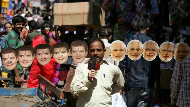 Anand Kumar Bowmick, a social activist, carries masks of Prime Minister Narendra Modi and President of Congress party Rahul Gandhi through a busy street as he appeals people to vote in the second phase of general election in Chennai, Tamil Nadu. (P. Ravikumar / REUTERS) Anand Kumar Bowmick, a social activist, carries masks of Prime Minister Narendra Modi and President of Congress party Rahul Gandhi through a busy street as he appeals people to vote in the second phase of general election in Chennai, Tamil Nadu. (P. Ravikumar / REUTERS)