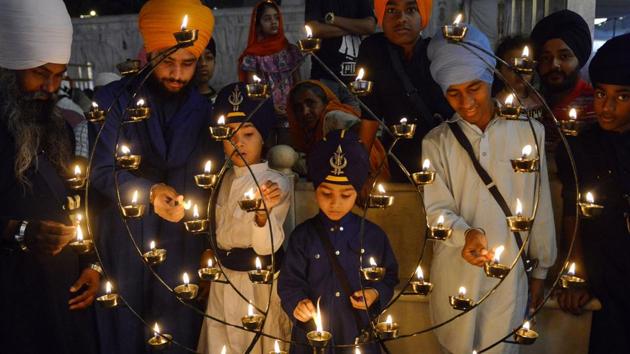 Devotees light candles on the occasion of the Baisakhi festival at the Golden Temple in Amritsar, Punjab. (Narinder Nanu / AFP) Devotees light candles on the occasion of the Baisakhi festival at the Golden Temple in Amritsar, Punjab. (Narinder Nanu / AFP)