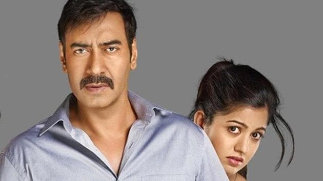 Ajay Devgn and Ishita Dutta in a promotional still for Drishyam.