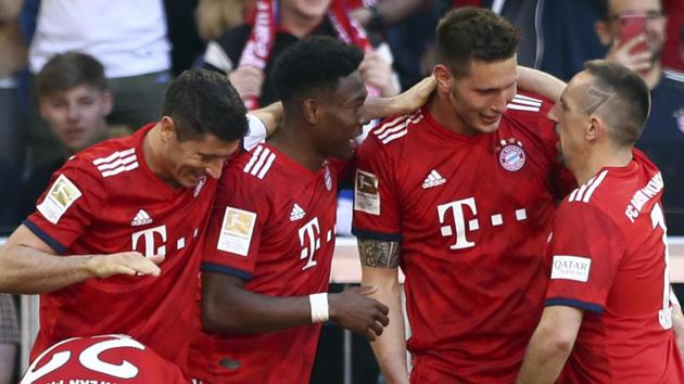 Bayern defender Niklas Suele, center right, celebrates with teammates after scoring his side's opening goal.(AP)