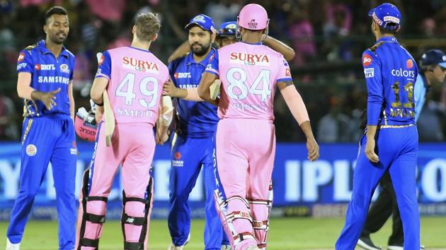 Mumbai Indians players, in blue, Rajasthan Royals players greet each other at the end of their match. (AP) Mumbai Indians players, in blue, Rajasthan Royals players greet each other at the end of their match. (AP)