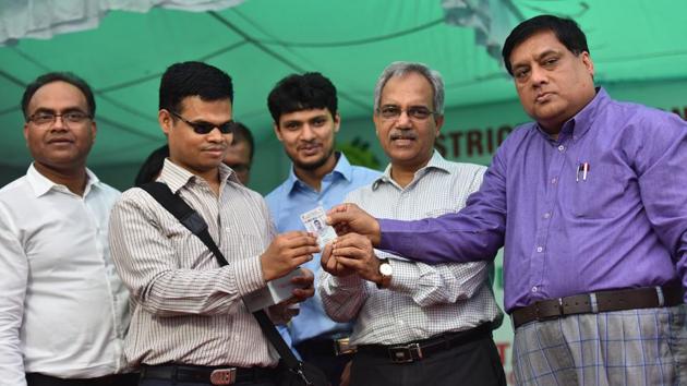 Chief Election Commissioner Ranbir Singh distributes the braille-coded voter card. “First time, East Delhi parliamentary constituency in Delhi took the initiative of issuing Braille-coded electoral photo identity cards to visually-impaired voters,” the Delhi CEO office said in a statement. (Sanchit Khanna / HT Photo)