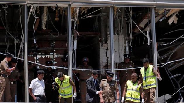 Crime scene officials inspect the explosion area at Shangri-La hotel in Colombo (REUTERS) Crime scene officials inspect the explosion area at Shangri-La hotel in Colombo (REUTERS)