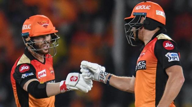 Sunrisers Hyderabad cricketers David Warner (L) and Jonny Bairstow gesture between the wickets.(AFP)