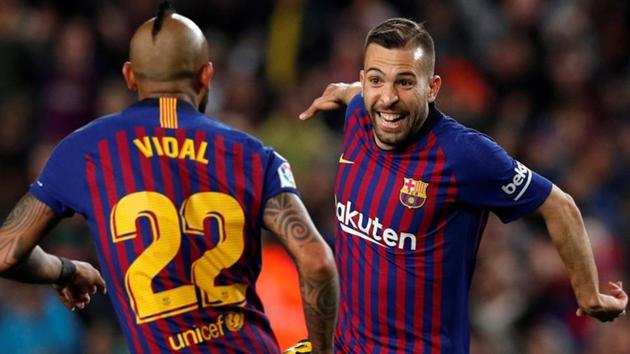 Barcelona's Jordi Alba celebrates scoring their second goal with Arturo Vidal. (REUTERS)