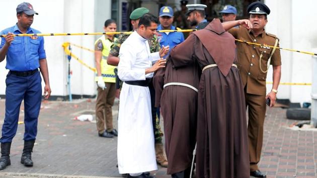 Priests walk into the St. Anthony's Shrine after the explosion. Heavy security has been deployed at the Bandaranaike International Airport after the multiple explosions in the country. The riot police and the Special Task Force, extra police security has been deployed around the airport, state-run Daily Times reported. (Dinuka Liyanawatte / REUTERS) Priests walk into the St. Anthony's Shrine after the explosion. Heavy security has been deployed at the Bandaranaike International Airport after the multiple explosions in the country. The riot police and the Special Task Force, extra police security has been deployed around the airport, state-run Daily Times reported. (Dinuka Liyanawatte / REUTERS)