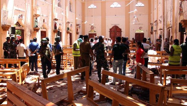 Sri Lankan security personnel walk past dead bodies covered with blankets amid blast debris at St Sebastian’s Church. At least nine foreigners were among 160 people killed in eight near simultaneous and coordinated explosions that rocked three churches and three luxury hotels frequented by tourists in Sri Lanka on Easter Sunday, in one of the deadliest blasts in the country’s history. (STR / AFP) Sri Lankan security personnel walk past dead bodies covered with blankets amid blast debris at St Sebastian’s Church. At least nine foreigners were among 160 people killed in eight near simultaneous and coordinated explosions that rocked three churches and three luxury hotels frequented by tourists in Sri Lanka on Easter Sunday, in one of the deadliest blasts in the country’s history. (STR / AFP)