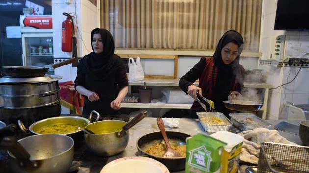 Afghan chefs work in a restaurant kitchen in Kabul. Other social media hashtags such as #afghanwomenwillnotgoback have also gained traction, and Khalilzad appears to have taken note. On a trip to Afghanistan this month, the Afghan-born American envoy met with locals from all walks of life and with women’s groups. (Wakil Kohsar / AFP) Afghan chefs work in a restaurant kitchen in Kabul. Other social media hashtags such as #afghanwomenwillnotgoback have also gained traction, and Khalilzad appears to have taken note. On a trip to Afghanistan this month, the Afghan-born American envoy met with locals from all walks of life and with women’s groups. (Wakil Kohsar / AFP)