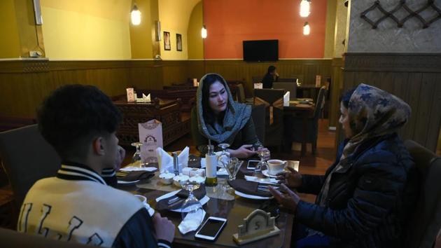Afghan men and women talk over tea at a restaurant in Kabul. The Taliban, however, appear unmoved. Spokesman Zabihullah Mujahid recently tweeted to deny reports that women were being included in the Taliban negotiating team and “neither do we believe it is necessary”. (Wakil Kohsar / AFP) Afghan men and women talk over tea at a restaurant in Kabul. The Taliban, however, appear unmoved. Spokesman Zabihullah Mujahid recently tweeted to deny reports that women were being included in the Taliban negotiating team and “neither do we believe it is necessary”. (Wakil Kohsar / AFP)